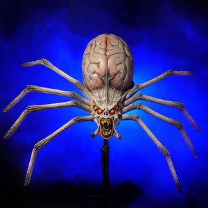 Giant Alien Spider Halloween prop by Distortions Unlimited prowls its creepy scene