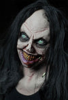 Scary girl animatronic with creepy smile and bloody mouth