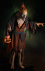 Pumpkin Witch haunted prop stands in the dark with creepy green fog and glowing evil jack o lantern