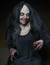 Rancid creepy girl Halloween animatronic prop with scary eyes and smile