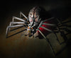 Giant Alien Spider prop sits on the floor with a spooky red glow