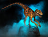 Velociraptor dinosaur animatronic in blue fog