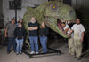 Distortions Unlimited crew with giant TREX Dinosaur head crafted at Distortions