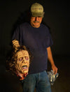 Severed Head puppet costume prop held by Mike Glover of Distortions Unlimited