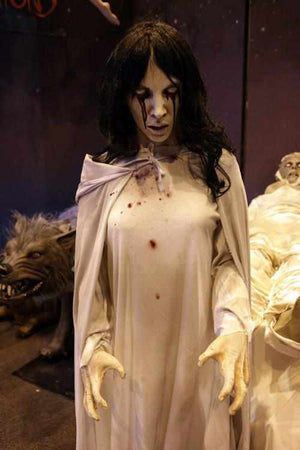 La Llorona Halloween prop, ghostly woman in white cries blood