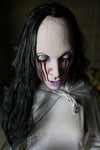 Face and eyes of La Llorona Halloween Prop dressed in white with long black hair crying tears of blood.