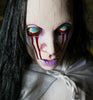 La Llorona with ghost face and bleeding eyes Halloween prop