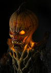 Face of the Pumpkin Stalker creepy Halloween display by Distortions Unlimited with spooky glowing eyes