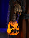 Pumpkin Witch prop holding a creepy little jack o lantern