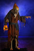 Distortions Unlimited Pumpkin Witch standing Halloween prop in a haunted scene with blue fog
