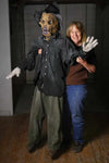 Marsha Taub-Edmunds hold the Scary Scarecrow life size Halloween prop for haunted corn mazes and home haunts