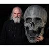 Distortions owner Ed Edmunds with the giant Stone Skull prop