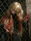 Animatronic zombie behind fence