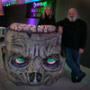 Distortions Unlimited owners Ed and Marsha Edmunds stand with the Zombie Podium at Monster World.